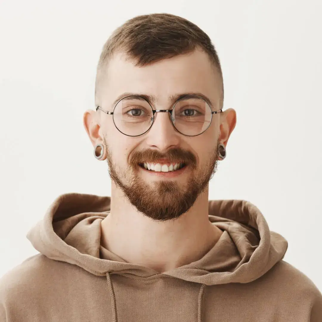 smiling-hipster-guy-glasses-hoodie-looking-happy